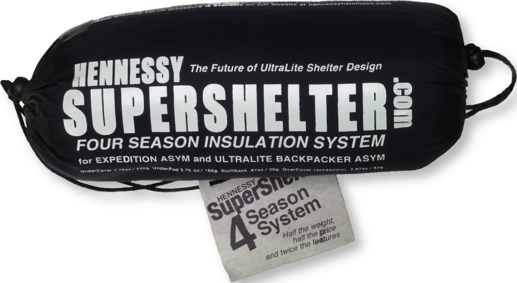 Hennessy Supershelter four season insulation system bag with white text, shown on a white background with a folded paper insert.
