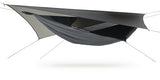 Photo of a grey Deep Jungle XL hammock set up against a white background.