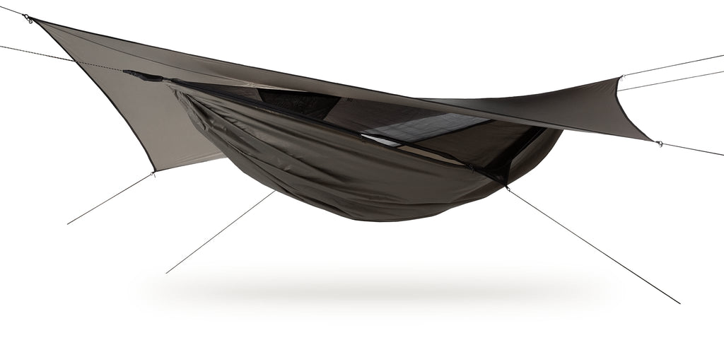 Photo of an Ultralite Backpacker hammock set up against a white background.  The hammock is bark colored.